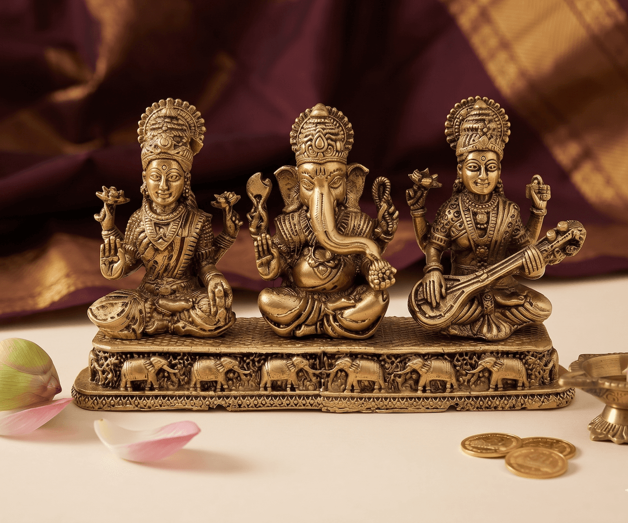 Superfine Laxmi Ganesh Saraswati Brass Idol on Carved Elephant Base (3.5" H x 6" L x 1.5" W)
